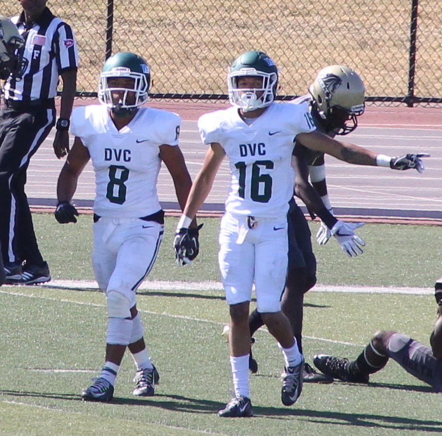 Wide receivers Cameron Norfleet (8) and Brandon Perrilliat (16) head back to the huddle after converting a first down against Delta College in Stockton, California on September 30, 2017.